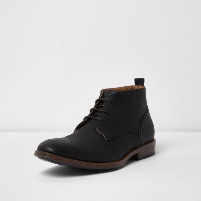 Black perforated chukka boots